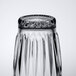 A clear, upside-down Libbey Winchester 12 oz. beverage glass with a textured pattern.