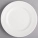 A round white porcelain plate with a wide rim.