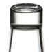 A clear, upside-down highball glass with a thick base.