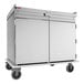 A stainless steel meal delivery cart with two doors, top rail, and four wheels, designed to hold 20 trays sized 15 x 20 inches.