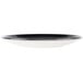 A small, round, black and white porcelain coupe plate.