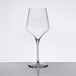 A clear, stemmed wine glass with a modern angular bowl and subtle pour control markings.