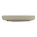 A beige porcelain deep raised rim plate.
