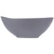 A gray matte porcelain bowl with an organic, curved shape.