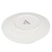 A white porcelain plate shown upside down with branding on the bottom.