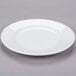 A plain white porcelain dinner plate.