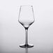 A clear, 16 oz. plastic wine glass with a modern, angular bowl and a long stem.
