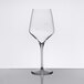 A clear, stemmed wine glass with pour control markings on the bowl.