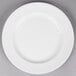 A round white porcelain plate with a wide rim.
