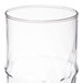 A clear 16 oz. specialty cooler glass with a slightly contoured shape.