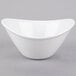 A small, bright white oval porcelain bowl.