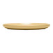 A tan terracotta stack plate with a flat, round design.
