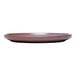A mauve terracotta stack plate with a slightly raised rim.