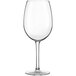 A clear, stemmed wine glass with a rounded bowl and flat base.