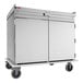 A stainless steel meal delivery cart with two doors, four wheels, and a top rail, designed to hold 20 trays sized 14 by 18 inches.