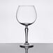 A clear Libbey Speakeasy 19.5 oz. gin and tonic glass with a wide bowl and long stem.