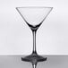 A clear, stemmed martini glass with a wide bowl and a flat base.