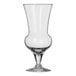 A clear 15 oz. thistle-shaped cocktail glass with a short stem and wide base.