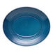 A blue oval terracotta platter with concentric circular ridges.