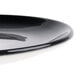 A close-up of a black porcelain coupe plate with a glossy finish.