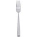 A stainless steel dinner fork with a textured handle.