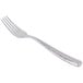 A stainless steel dinner fork with a textured handle.