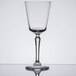 A clear Libbey Speakeasy 8.25 oz. cocktail glass with a tall stem and wide bowl.
