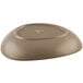 A sand-colored, oval-shaped porcelain coupe plate with a matte finish, shown upside down.