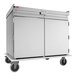A stainless steel meal delivery cart with two doors and four wheels, designed to hold 20 trays sized 14 by 18 inches.