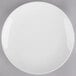 A plain white round porcelain coupe plate.