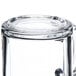 A clear glass mug turned upside down.