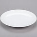 A plain white porcelain coupe plate.