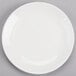 A plain white round porcelain coupe plate.