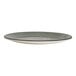 A round, smoke-colored melamine coupe plate with a slightly raised rim.