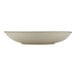 A round, shallow, beige porcelain coupe plate.