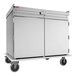 A stainless steel meal delivery cart with two doors and four wheels, designed to hold 20 trays sized 15 by 20 inches.