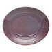 A mauve oval terracotta platter with a ridged design around the edge.