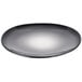 A round, dark-colored porcelain plate with a smooth, slightly concave surface.