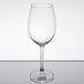 A clear, stemmed wine glass with a rounded bowl and flat base.