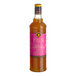 A 750 mL bottle of Liber & Co Tropical Passionfruit Syrup with a pink label.