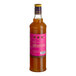 A 750 mL bottle of Liber & Co Tropical Passionfruit Syrup with a pink label.