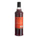 A 750 mL bottle of Liber & Co Blood Orange Cordial Syrup with a red label and black cap.