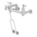 A silver T&S mop sink faucet with two blue handles.