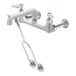 A T&S chrome mop sink faucet with a handle.