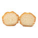 A pair of round, golden-brown churro bites with a sugar-coated exterior and a soft, airy interior.