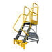 A heavy-duty, 7-step powder-coated steel rolling ladder with yellow handrails and perforated treads.