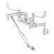 A T&S chrome wall mount mop sink faucet with two wrist action handles and inlet extension.