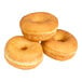 A group of three plain yeast-risen mini donut rings.