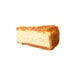 A slice of ricotta cheesecake with a crumbly topping and crust.