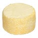 A large round lemon blueberry cake with a smooth top and sides covered in yellow sprinkles.